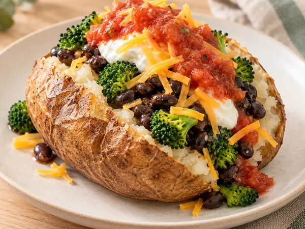AI-generated serving illustration of Baked potato, bean & broccoli plates