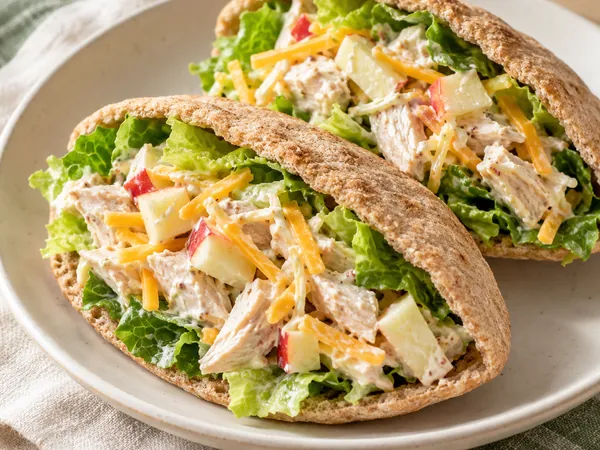 AI-generated serving illustration of Apple-cheddar chicken salad pitas
