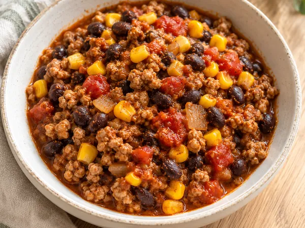 AI-generated serving illustration of Turkey & black bean skillet chili
